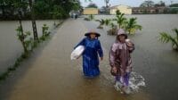 Ilustrasi banjir (Foto: The Guardina/Manan Vatsyayana/AFP/Getty